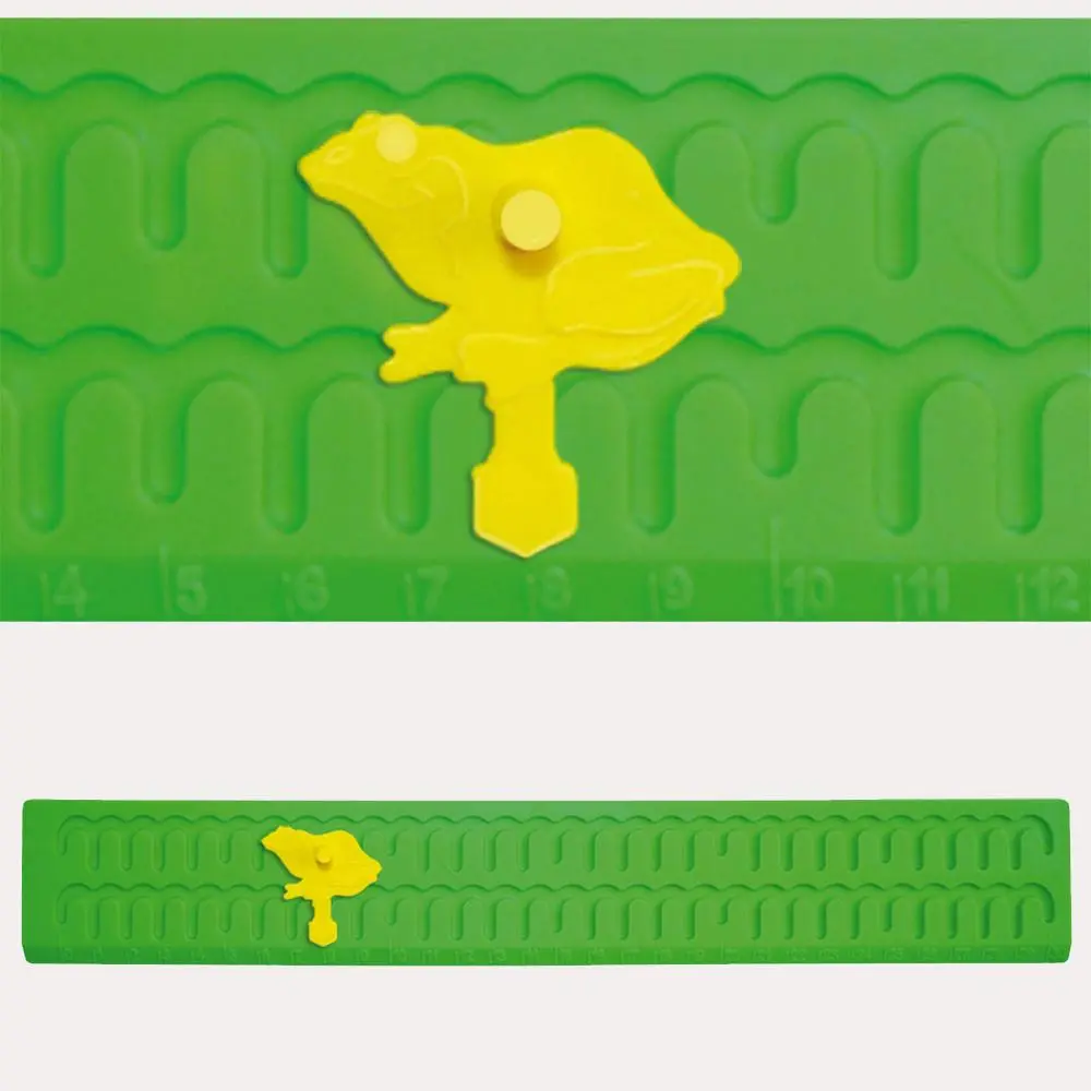 Regla con rana saltarina